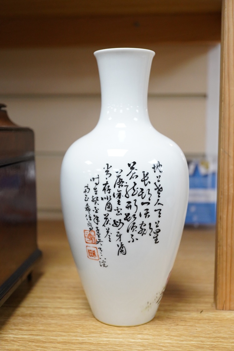 A Chinese famille rose vase, decorated with Shou Lao and script, 23cm